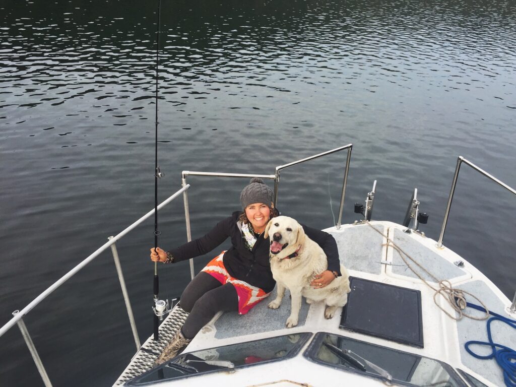 fishing with your dog on a boat - Mallory Paige