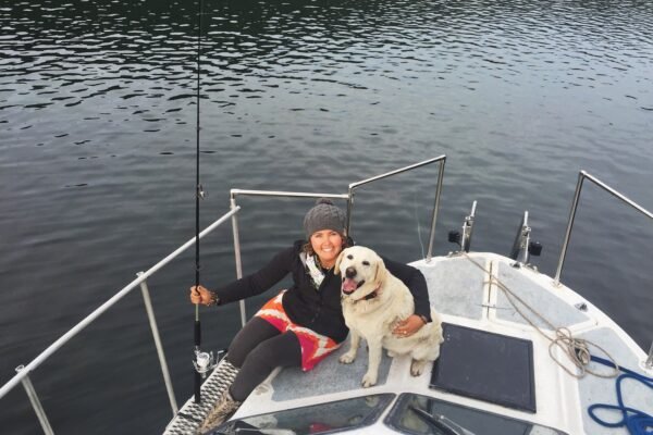 fishing with your dog on a boat - Mallory Paige
